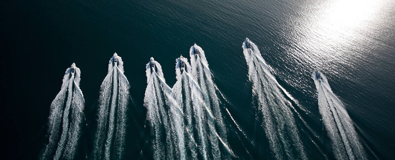 Bird view of game fishing boats in one row heading out to the Great Barrier Reefs