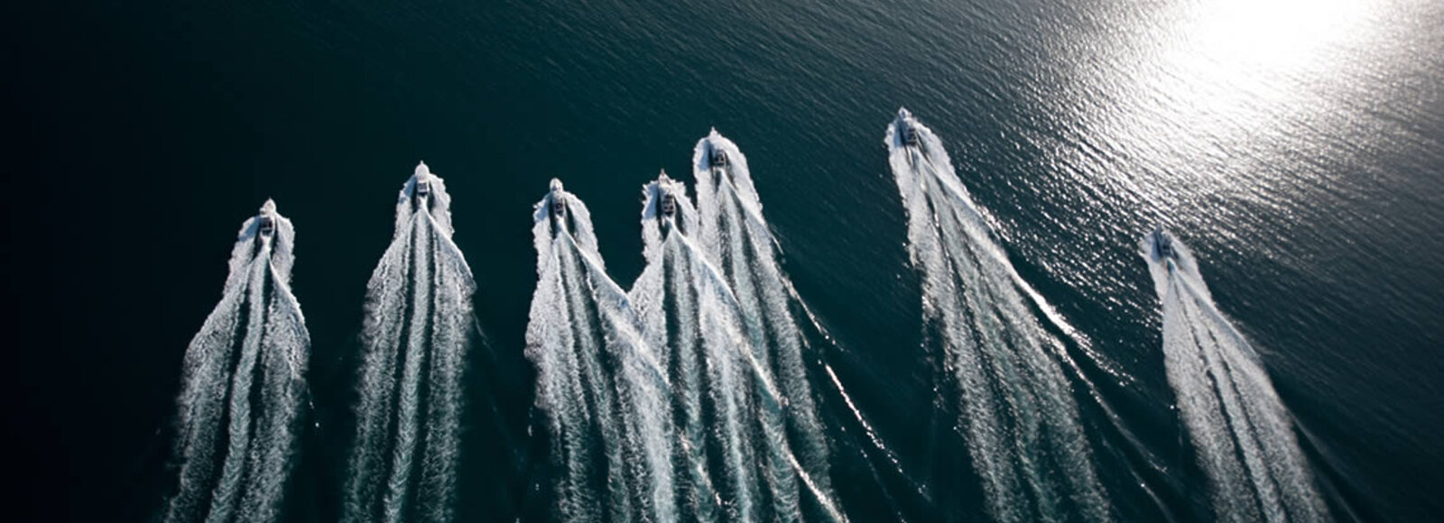 Bird view of game fishing boats in one row heading out to the Great Barrier Reefs