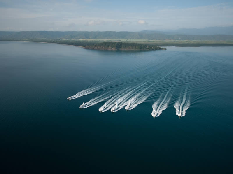 Birds view of game fishing boats leaving Port Douglas